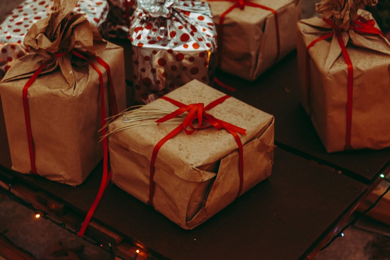 Home Charming rustic presents with brown paper and red ribbons, perfect for festive occasions.
